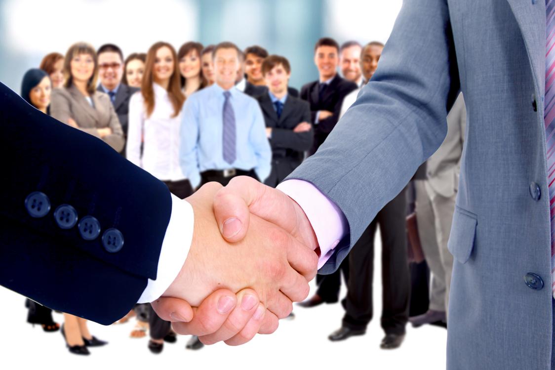 Professional handshake representing an NYCET franchise partnership